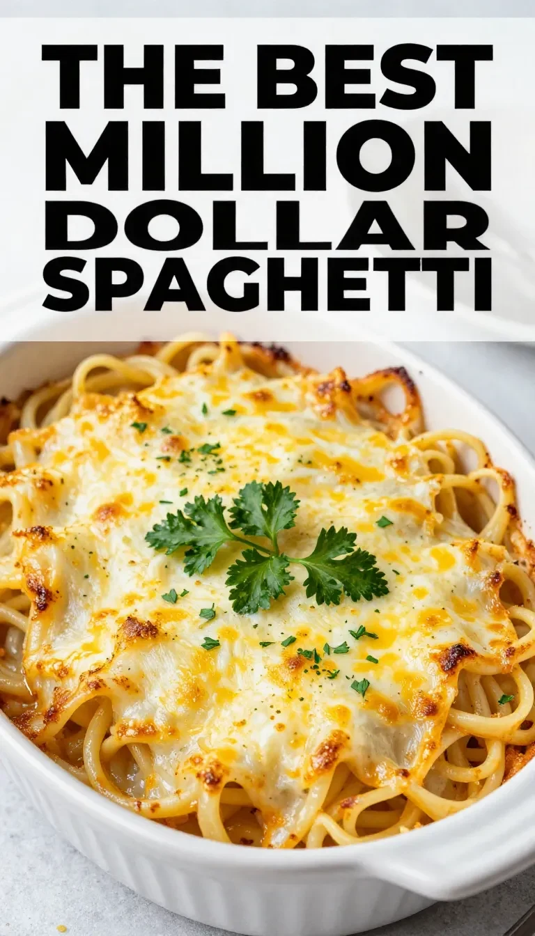 A freshly baked casserole dish of Million Dollar Spaghetti topped with melted cheese and garnished with parsley.