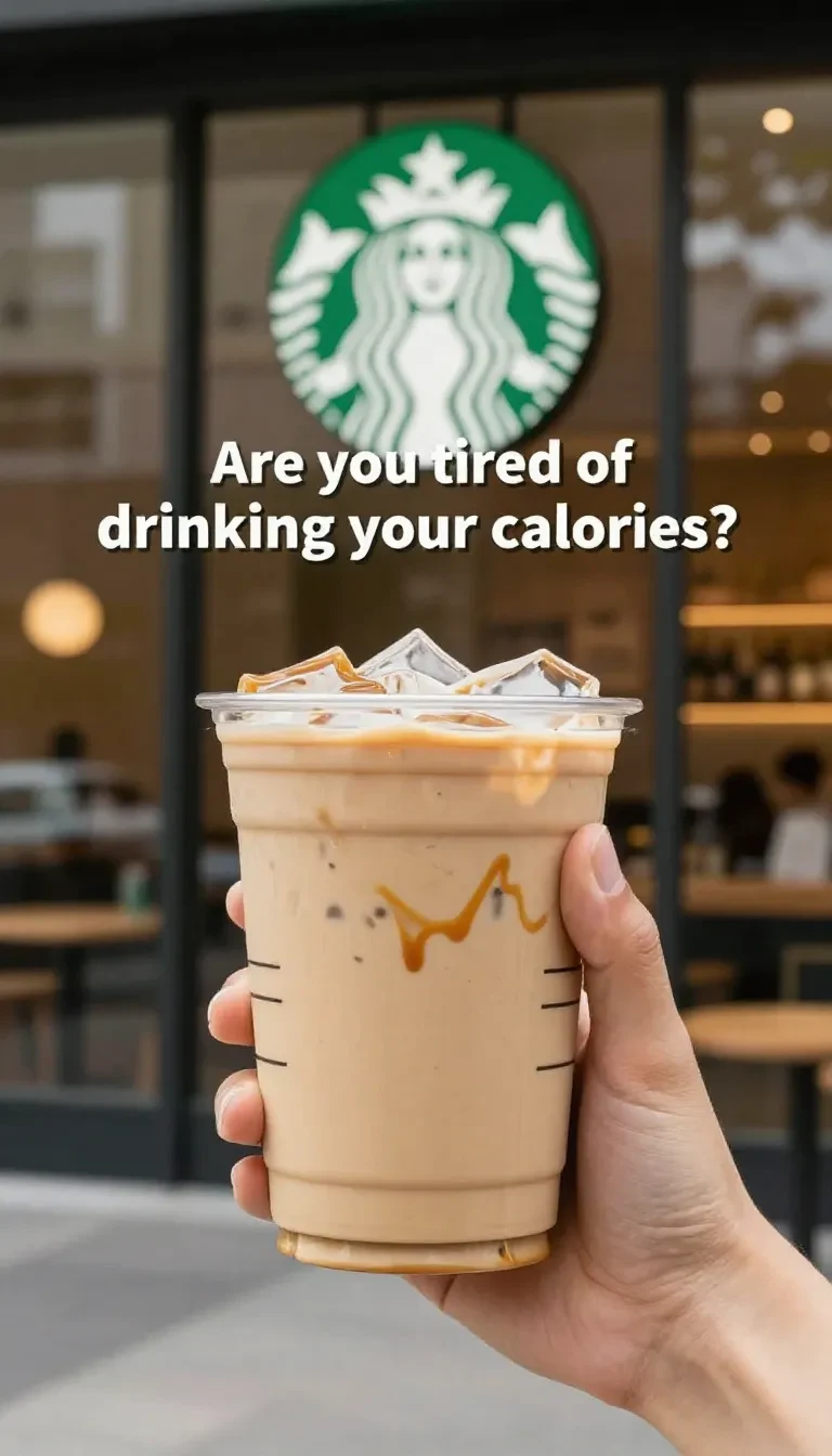 A healthy low-calorie fall-inspired Starbucks-style drink in a glass with ice, cinnamon, and pumpkin spice on a rustic table.